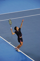 Getting ready to return a tennis volley in a woman’s tennis game