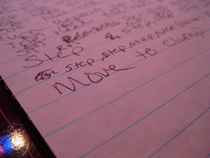 A photograph of words handwritten on a lined page. The most visible words say “move to the clump.”