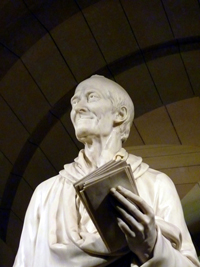 marble statue of Voltaire that has been photographed from the waist up