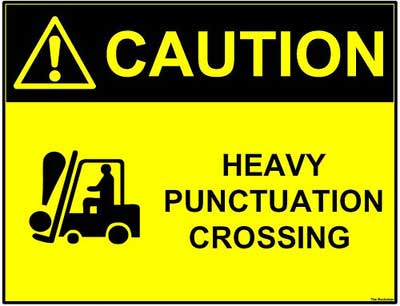 An image of a sign that reads, “Caution! Heavy Punctuation Crossing”