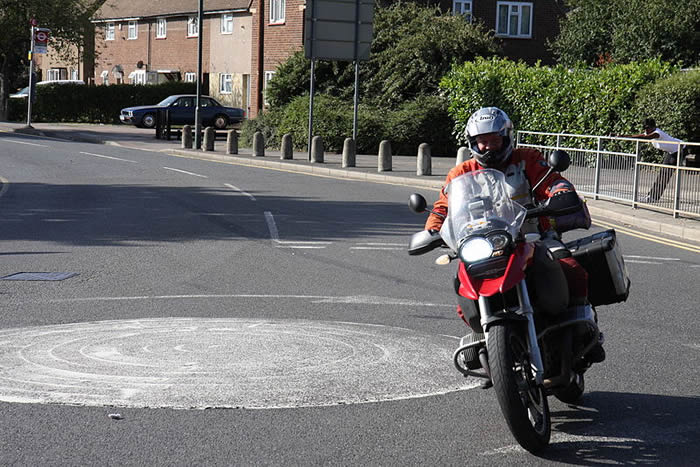 Image of a motorcycle driving away.