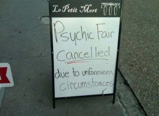 An ironic image of a chalkboard that reads ‘Psychic fair cancelled due to unforeseen circumstances’