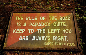 Road sign that says: “The rule of the road is a paradox quite, keep to the left you are always right.”