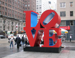 Photo of LOVE sculpture by Robert Indiana, on the corner of 6th Avenue and 55th Street in Manhattan, NY.