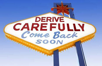 Las Vegas-style sign, “Derive Carefully, Come Back Soon.”