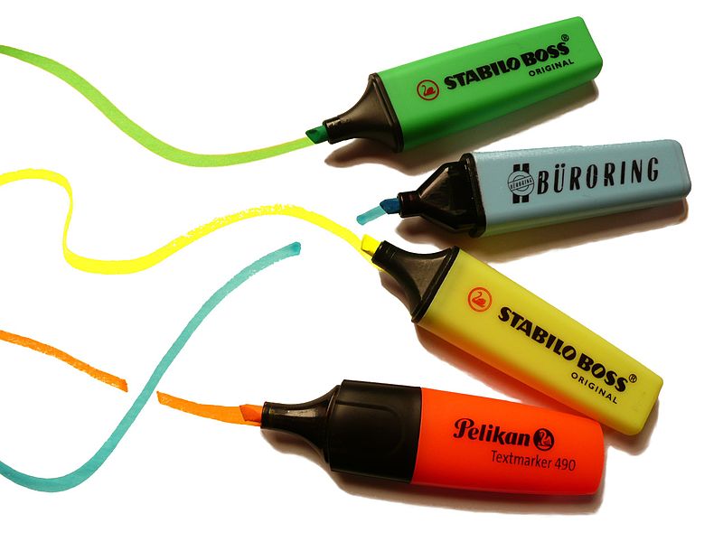 Highlighter pens in multiple colors are shown.
