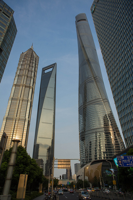 Skyscrapers loom over a city street