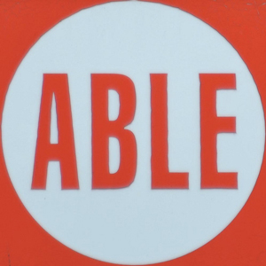A sign in a store window that reads “Official ‘OLOGY Destination Store”