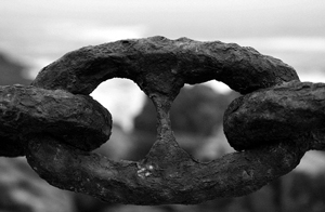 A photograph of carved chain links