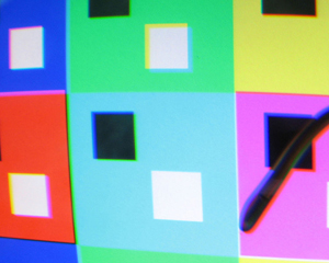 A photograph of a contemporary painting of different colored squares.