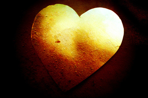 A photograph of a painted heart of gold.