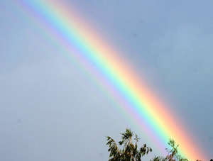 A photograph of a section of a rainbow in the sky