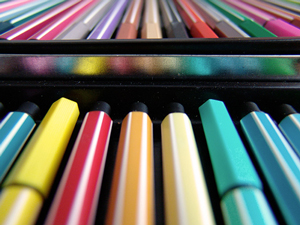 A photograph of a colored pen and pencil set