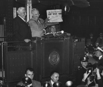 President Truman holding a copy of the newspaper with a false headline