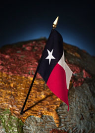 Texas flag placed on Texas on a globe