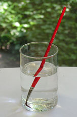 paint brush in water appears broken when viewed from the side