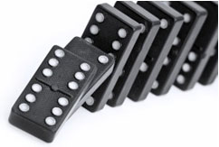 image is of dominoes falling