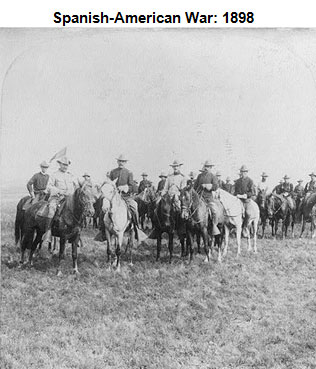 Image of a cavalry of men on horseback, led by Theodore Roosevelt