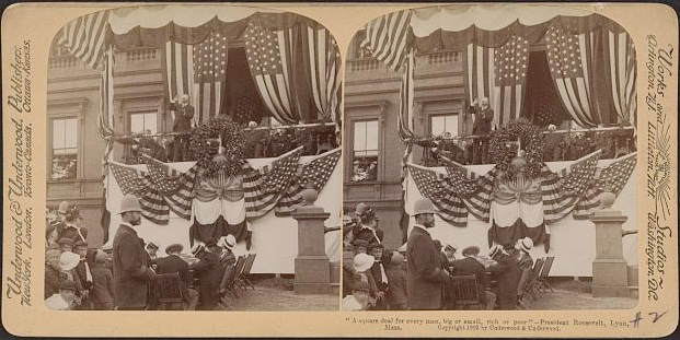 Image of a photo of Theodore Roosevelt speaking on an American –flag draped podium in front of a crowd. There are two photos of the same image side by side.