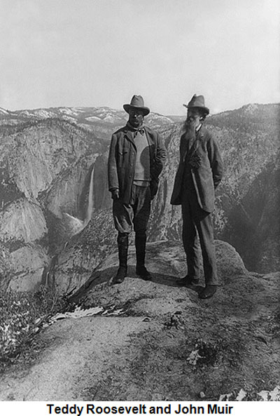 A photograph of Naturalist John Muir and Teddy Roosevelt standing on a rock overlooking a valley.