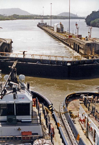 Image of two tug boats waiting at the locks in the Panama Canal.