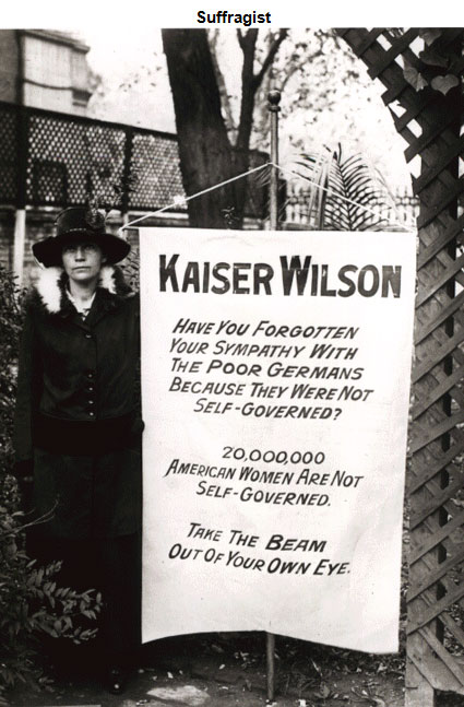 Image of a woman standing next to a sign addressed to 'Kaiser’ Wilson