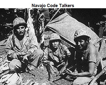 Image of three Navajo Code Talkers seated in front of a tent