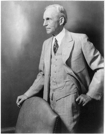 Photo of Henry Ford standing with his hand in his pants pocket