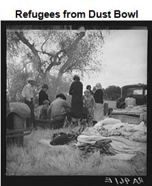 Image of several family members standing under a large tree. Sheets and blankets are located in the foreground.