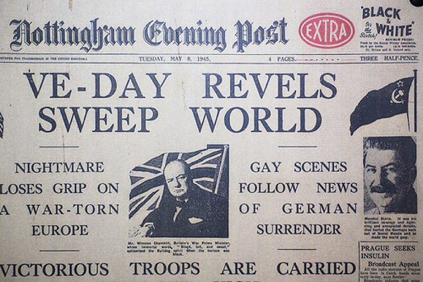 Image of the front page of the Nottingham Evening Post newspaper. Paper is dated Tuesday, May 8th, 1945. The title of the page reads: 'VE-Day Revels Sweep World'.