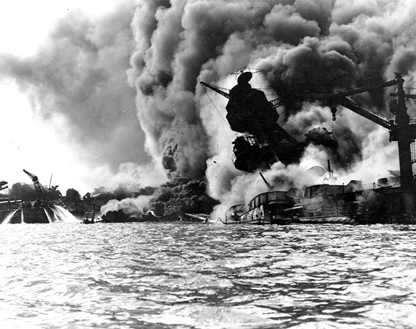 A photograph of The USS Arizona burning at Pearl Harbor, Hawaii.