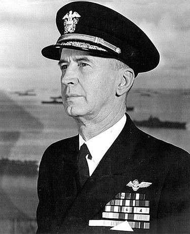 A photograph/portrait of Commander in Chief of the United States Navy Admiral Ernest King. He is man in late middle age wearing a United States Navy uniform.