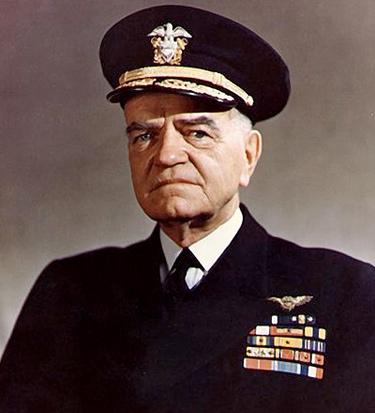 A photograph/portrait of Admiral William Halsey. He is man in late middle age wearing a United States Navy uniform