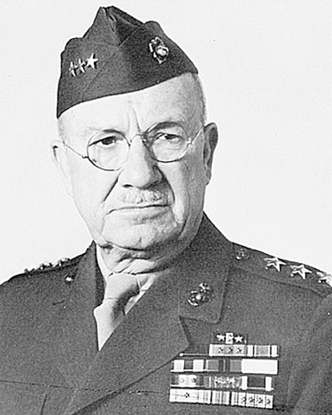 A photograph/portrait of General Holland Smith. He is man in late middle age wearing a United States Marine Corps uniform.
