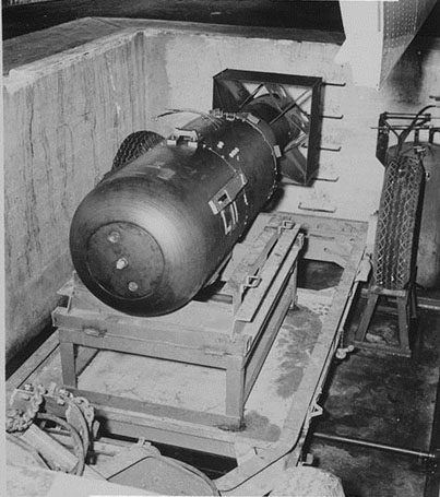 'Little Boy' the first atomic bomb developed for use in combat. It is a cylindrical device with fins on the tail.