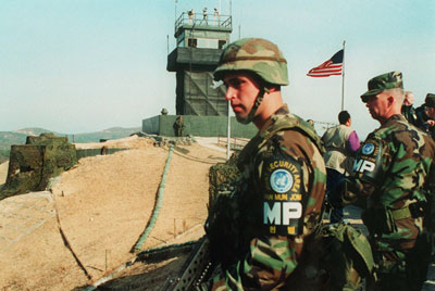 Photo of military police of the Joint Security Area stand watch at the observation tower at Panmunjom, DMZ Korea.