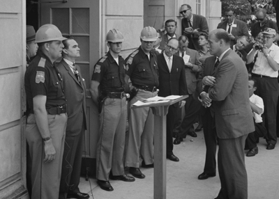 Photograph of Alabama Governor George Wallace confronting the Attorney General of Alabama at the doors of the University of Alabama