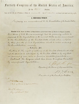 Image of a page from the constitution that displays the 15th Amendment that is handwritten