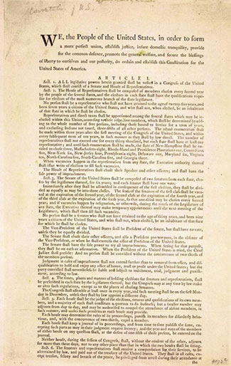 A copy of the first page of the United States Constitution.