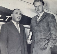 Image of Martin Luther King and Billy Graham standing in front of an airplane