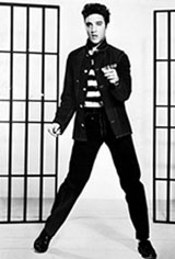 Image of Elvis Presley standing between two jailhouse bars.